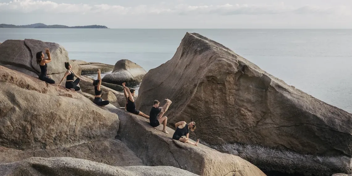 group yoga on the rocks