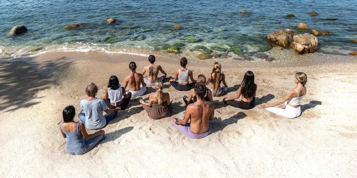 group yoga on the beach