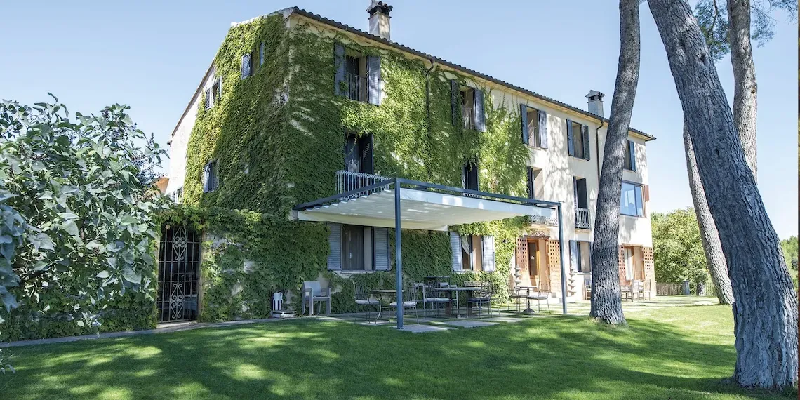 Hotel | MasQi - The Energy House hotel exterior with garden