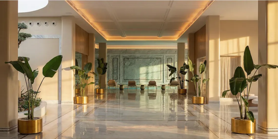 spa entrance to pool with plants and loungers