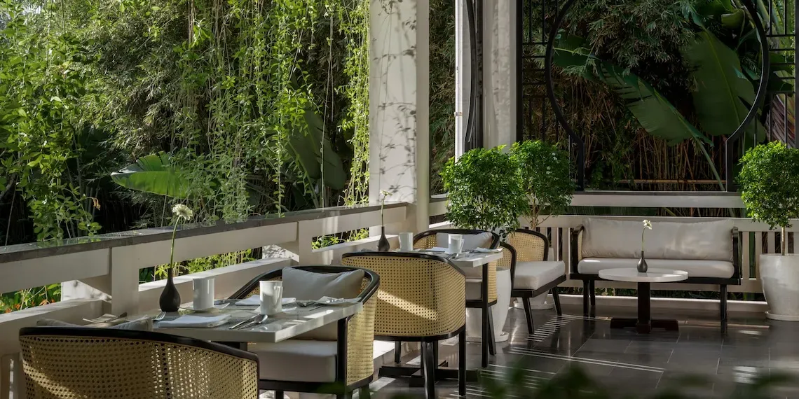 tables and chairs with view of tropical gardens