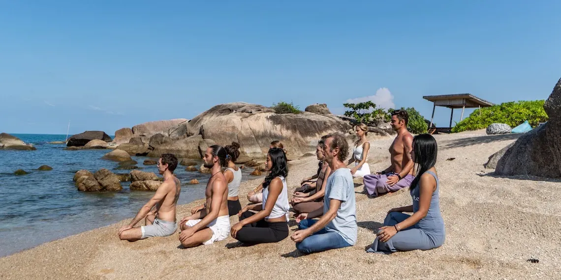 group yoga on the beach