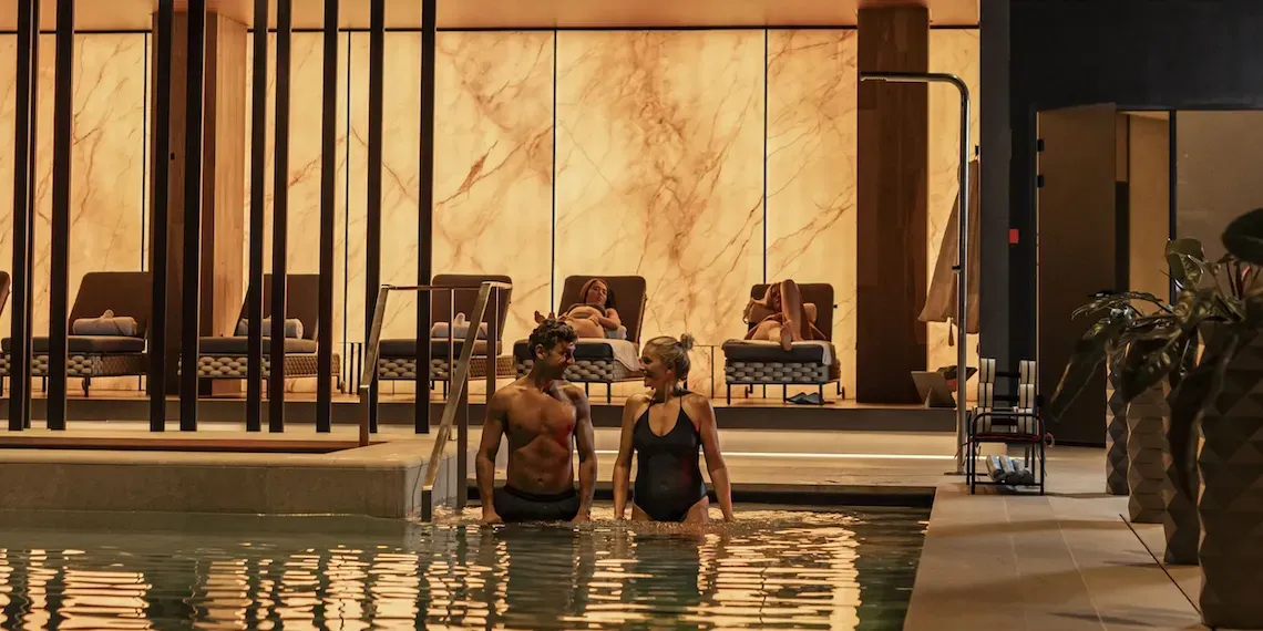 two people in an indoor pool