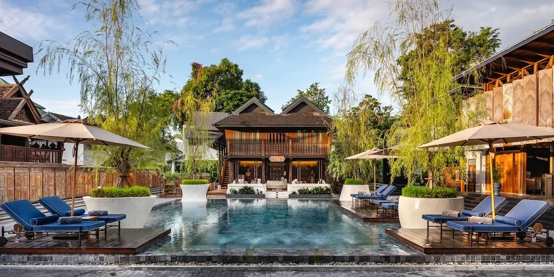 hotel with pool and sunloungers