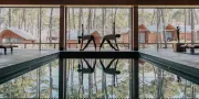 two people in yogapose at the pool