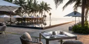 table at pool with ocean view