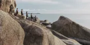 group yoga on rocks