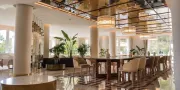 restaurant with big table and chairs with a glass ceiling