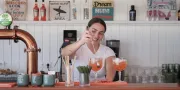 woman making cocktail at the bar