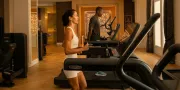 man and woman on a treadmill in a luxury gym