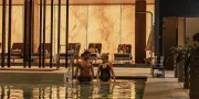 two people in an indoor pool