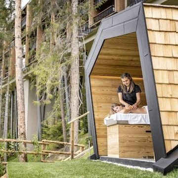 woman getting a massage from a woman in nature