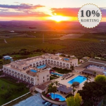 sunset with hotel and pool and vineyards 